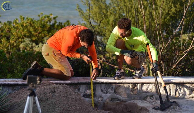 Two men installing the power cable